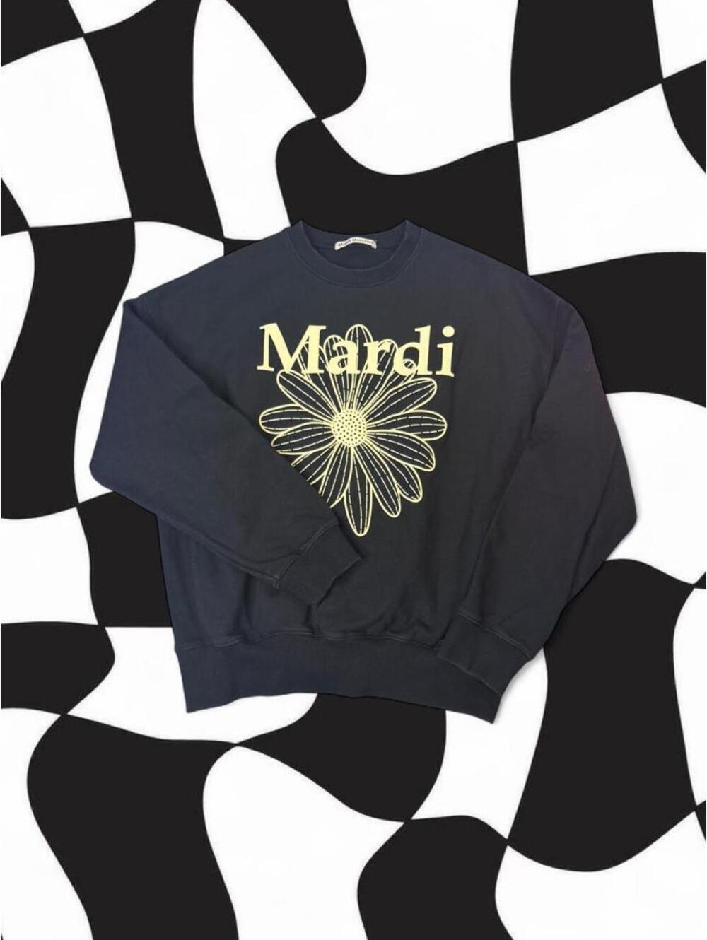 Mardi Mercredi black cotton crewneck sweatshirt with white daisy graphic
